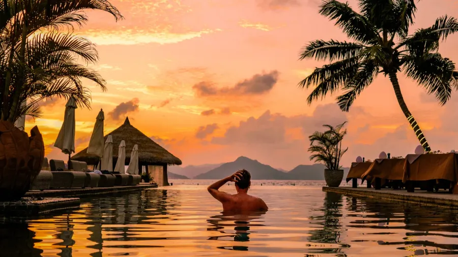 a young man enjoys a tranquil moment by a luxury