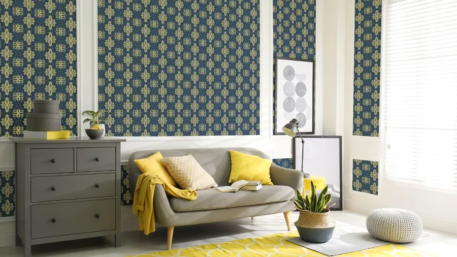 Sustainable wallpapers. A stylish living room with patterned wallpaper, a gray couch, and vibrant accents.