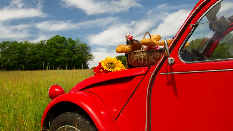 french car with bread and wine